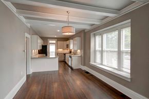 Denver apartment for rent - a kitchen with a large window and a wooden floor