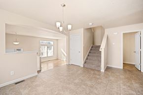 Castle Rock apartment for rent - A spacious living room with a staircase leading to the second floor.