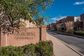 Boulder apartment for rent - a brick wall with a sign that reads the avalon condominiums