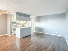 Englewood apartment for rent - A kitchen with a white island in the middle of the room.