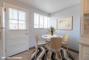 Lakewood apartment for rent - A dining room with a white table and chairs.