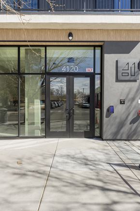 Denver apartment for rent - The image shows the entrance to a building with a glass door and a sign that reads "4120".