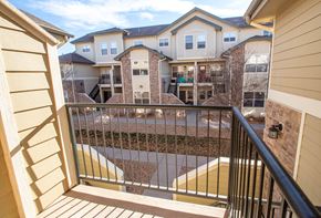 Denver townhouse for rent - A balcony view of a multi-story residential building.