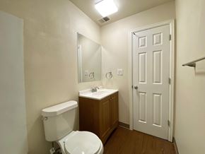 Commerce City apartment for rent - A white toilet sits next to a sink in a small bathroom.