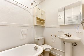 Denver apartment for rent - a bathroom with a toilet sink and bathtub