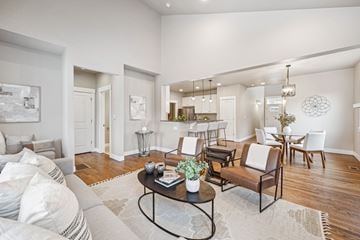 Denver townhouse for rent - A living room with a white couch and a coffee table.
