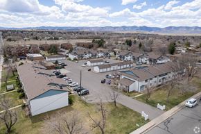 Lakewood apartment for rent - an aerial view of a neighborhood of buildings and parking lot