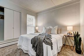 Greeley apartment for rent - a bedroom with a bed and a window