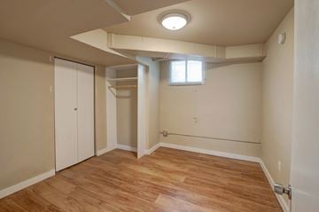 Boulder triplex for rent - a bedroom with a closet and a window and a hard wood floor