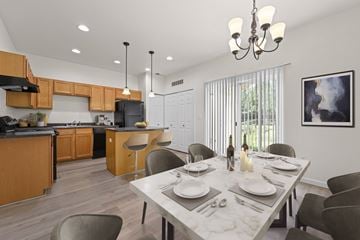 Thornton townhouse for rent - A modern kitchen with a dining table set for two.