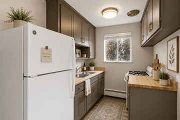 Denver apartment for rent - A white refrigerator with a note on it in a kitchen.
