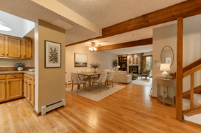 Boulder townhouse for rent - A spacious living room with a dining area and a staircase.