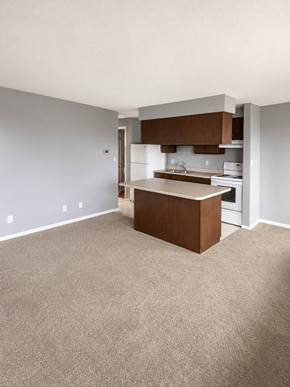 Englewood apartment for rent - A kitchen with a white wall and a brown island.