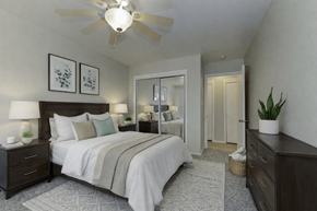 Lakewood apartment for rent - A bedroom with a large bed and a ceiling fan.