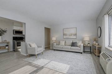 Lakewood apartment for rent - A living room with a white couch and a grey rug.