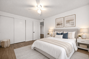 Denver apartment for rent - A bedroom with a large bed and two nightstands.