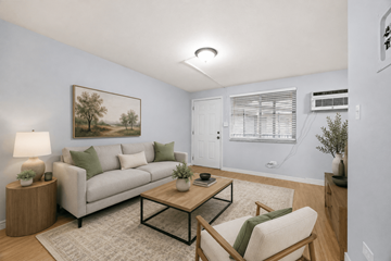 Denver apartment for rent - A living room with a couch, chair, and a painting on the wall.