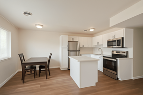 Boulder triplex for rent - A kitchen with a table and chairs in it.