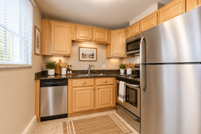 Denver apartment for rent - A kitchen with wooden cabinets and a stainless steel refrigerator.
