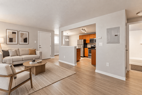 Denver apartment for rent - A living room with a couch, chair, and coffee table.