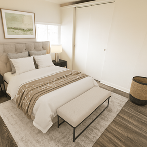 Denver apartment for rent - A bedroom with a large bed and a bench.