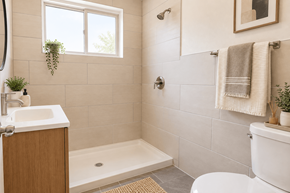 Wheat Ridge apartment for rent - A bathroom with a white toilet, a white sink, a white bathtub, and a window.