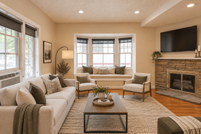 Denver apartment for rent - A living room with a fireplace and a couch.