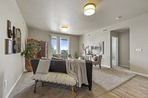 Fort Collins apartment for rent - A living room with a couch, chair, and a rug.