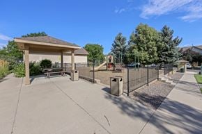 Thornton townhouse for rent - A playground with a swing set and a gazebo.
