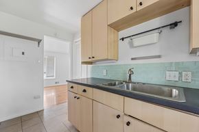 Denver apartment for rent - A kitchen with a sink and cabinets.
