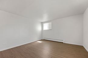 Commerce City apartment for rent - A room with a window and a radiator on the wall.