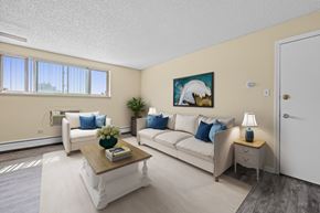 Commerce City apartment for rent - A living room with two couches, a coffee table, and a painting on the wall.