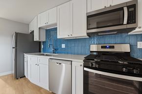 Boulder apartment for rent - A kitchen with a stove, dishwasher, and refrigerator.