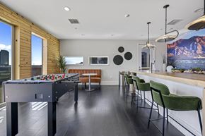 Denver apartment for rent - A room with a pool table and a bar area.