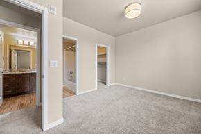 Fort Collins apartment for rent - A spacious room with a carpeted floor and a ceiling light.