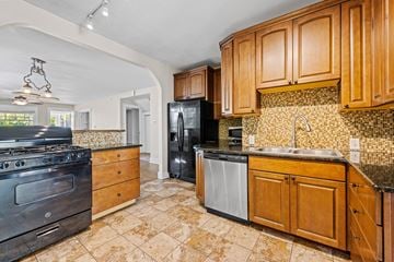 Denver apartment for rent - A kitchen with wooden cabinets and a black refrigerator.