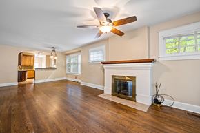 Denver apartment for rent - A living room with a fireplace and wood floors.