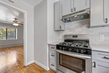 Denver apartment for rent - A kitchen with a stove and cabinets.