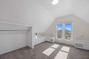 Denver apartment for rent - A room with a large window and a grey carpet.