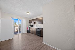 Lakewood apartment for rent - A kitchen with a refrigerator, oven, and microwave.