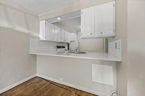Boulder apartment for rent - A kitchen with white cabinets and a white countertop.