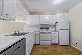 Boulder apartment for rent - A kitchen with white cabinets and appliances.