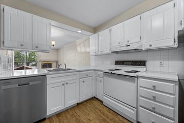 Boulder apartment for rent - A kitchen with white cabinets and appliances.