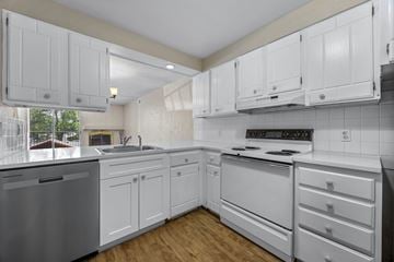 Boulder apartment for rent - A kitchen with white cabinets and appliances.