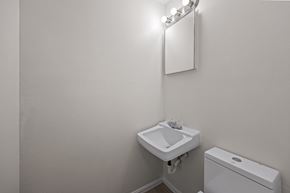 Westminster apartment for rent - A white sink and toilet in a small bathroom.
