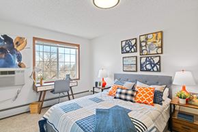 Greeley apartment for rent - a bedroom with a bed and a desk with a computer