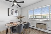 Littleton apartment for rent - a dining room with a table and chairs and a ceiling fan