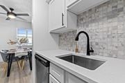 Littleton apartment for rent - the kitchen and dining area of a house with a sink