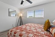 Littleton apartment for rent - the master bedroom has a large bed and a large window