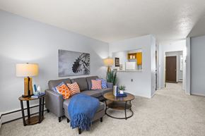 Greeley apartment for rent - the living room of our apartments with a couch and a coffee table